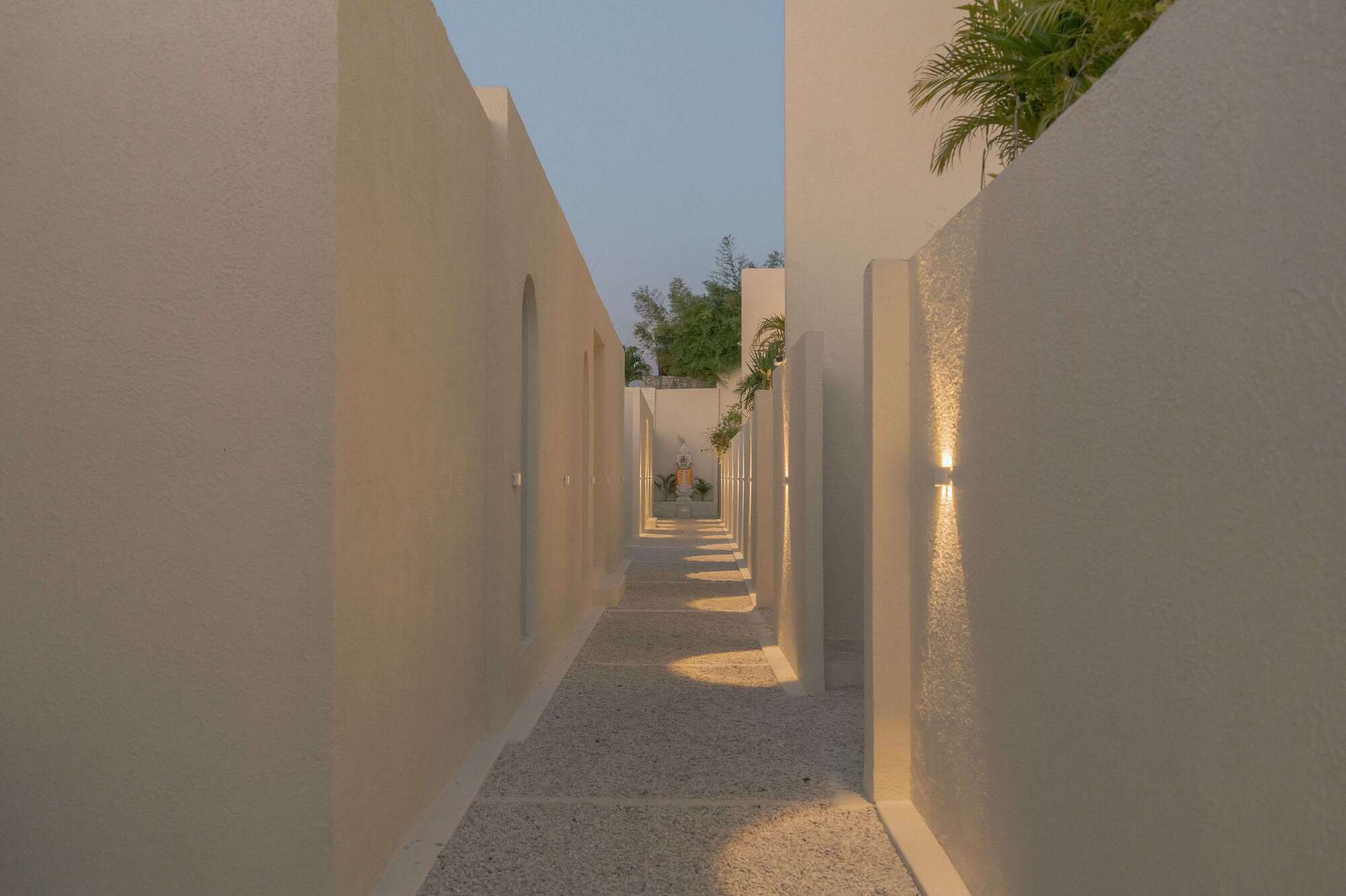 Luxury hotel exterior walkway with warm lighting